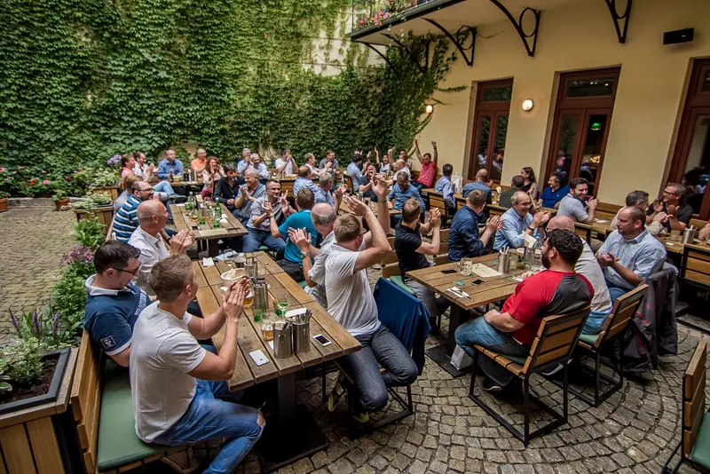 Large corporate team building group at an outdoor restaurant after Treasure Hunt Vienna